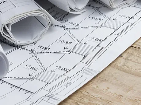 Office space planning drawings and rolled blueprints